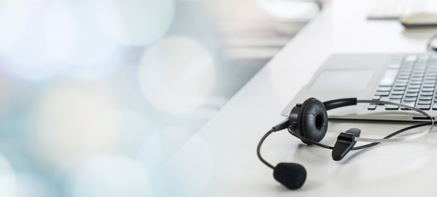 Dekorbild på dator och headset.